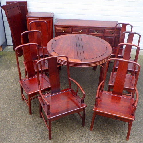 873 - An Oriental hardwood dining room suite comprising of extending dining table, 8 chairs, sideboard and... 