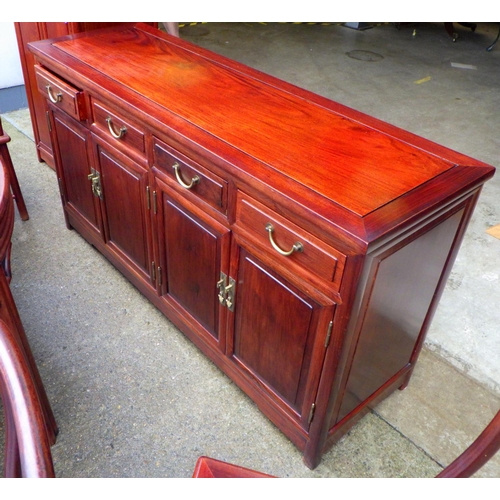 873 - An Oriental hardwood dining room suite comprising of extending dining table, 8 chairs, sideboard and... 