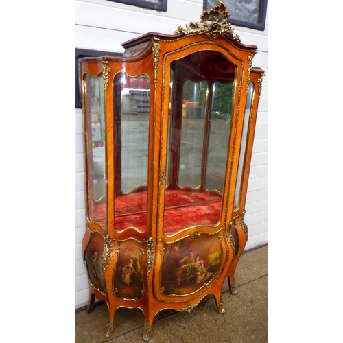 A kingwood & gilt metal mounted, Vernis Martin style, bombe vitrine display cabinet 194cm high 130cm wide, faded to one side, some panels cracking, with glass shelves, late 19th/early 20th cen