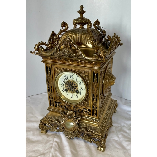 A large Brass clock striking mantle clock