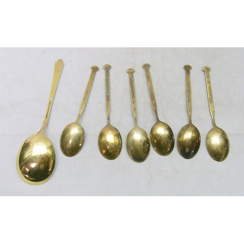 17 - A cased set of gilt white metal and enamel coffee spoons with a matching dessert-shaped spoons, Elgo... 