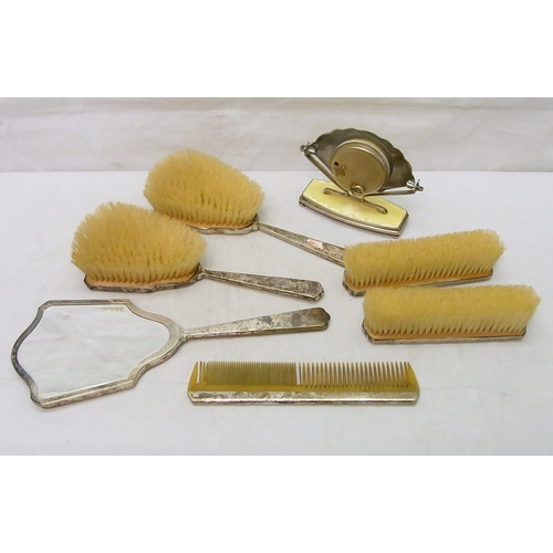 4 - An extensive part dressing table set comprising two pairs of brushes, a mirror, a comb and a bedside... 