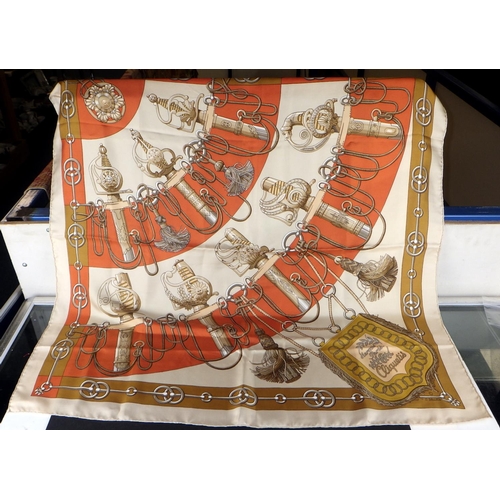 110 - A vintage Hermes scarf – “Cliquetis” Designed by Julia Abadie in 1972, in brown, grey and gold colou... 