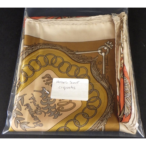 110 - A vintage Hermes scarf – “Cliquetis” Designed by Julia Abadie in 1972, in brown, grey and gold colou... 