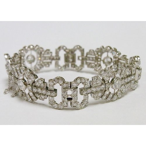 30 - A fancy panel bracelet comprising mixed round cut diamonds in a white metal setting, French bearing ... 