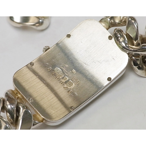 66 - A Quinn bracelet watch comprising a quartz movement beneath an enamel dial in a rectangular tonneau ... 