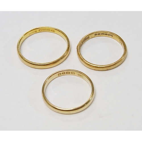 74 - Two 22ct gold band rings, 5g; a similar 18ct gold band ring, 2g.  (3)