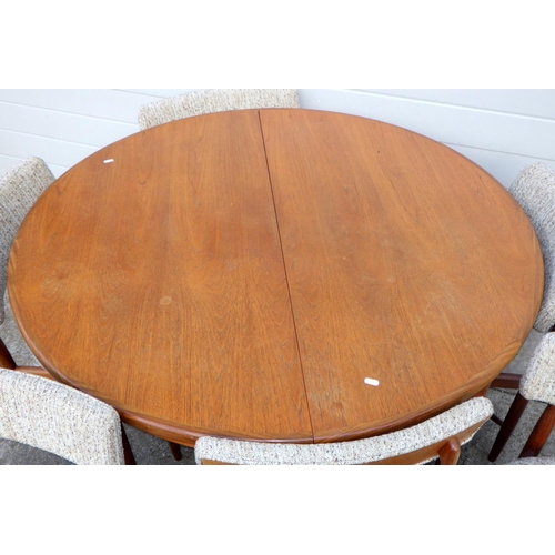 719 - A G.Plan teak extending circular dining table together with six chair frames (7)