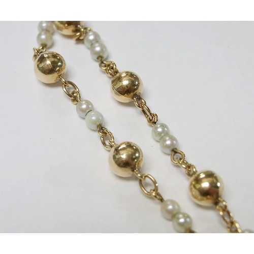 96 - A yellow metal and seed pearl bracelet, the end indistinctly marked, approximately 90mm long; a pair... 