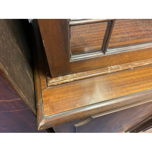 903 - A reproduction mahogany four door bookcase 205cm long x 215cm tall