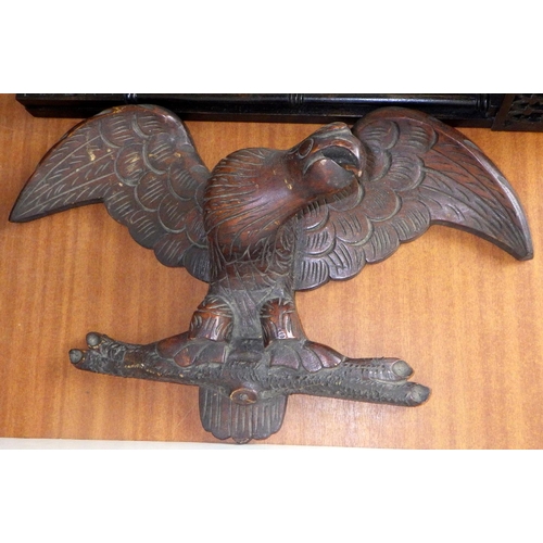 35 - A 19thC fretwork wall mirror with candle shelf together with a carved eagle (2)
