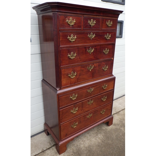 A mahogany chest on chest with fluted canted corners on bracket feet, Geo III style, 178cm tall, 107cm wide