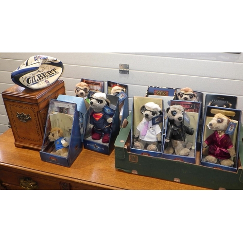 806 - Eleven Meerkat dolls, jewellery cabinet and a Bath rugby ball