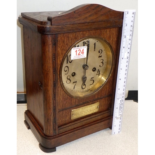 124 - A 1920s oak striking mantle clock, 'Presented to Miss G Griffiths for her three years of war work' 3... 