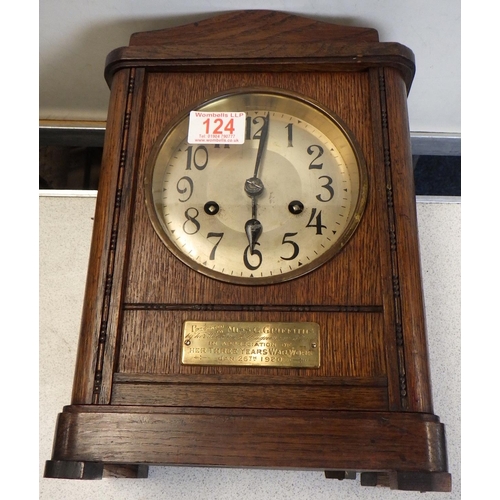 124 - A 1920s oak striking mantle clock, 'Presented to Miss G Griffiths for her three years of war work' 3... 