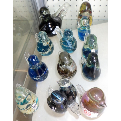 99 - A group of 12 mainly Mdina small glass paperweights