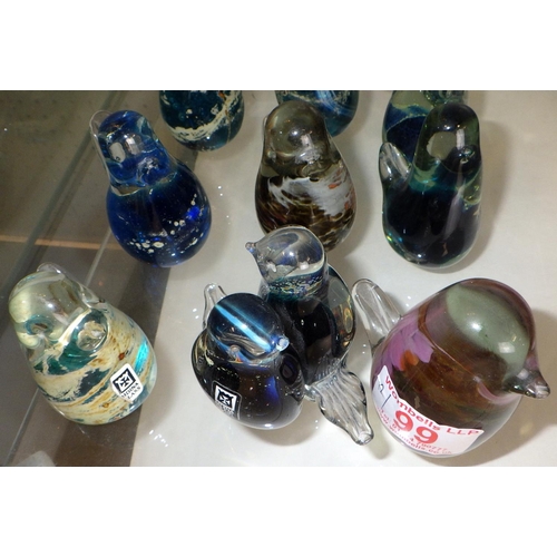 99 - A group of 12 mainly Mdina small glass paperweights