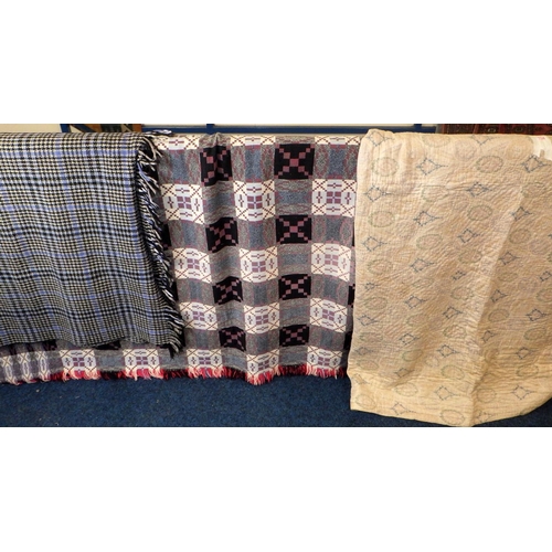 134 - A Welsh wool blanket together with a worn faded Paisley ?  quilt and a further rug (3)