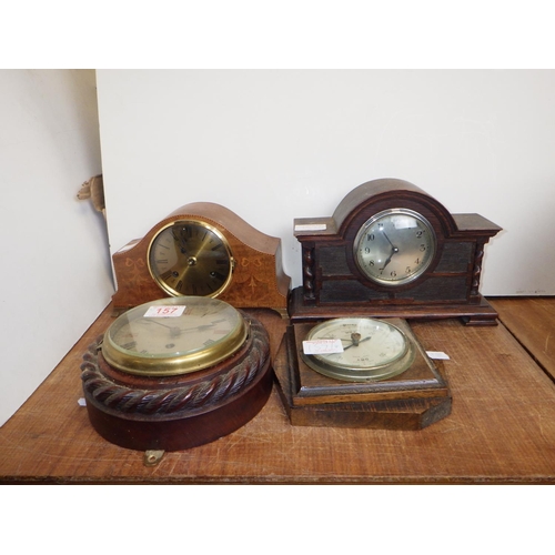 157 - Three early 20thC clocks together with a barometer (4)