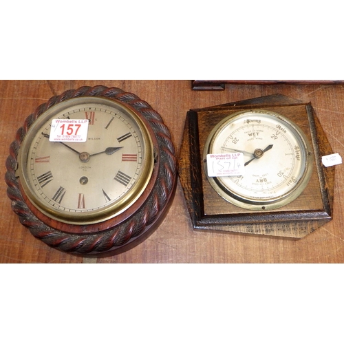 157 - Three early 20thC clocks together with a barometer (4)