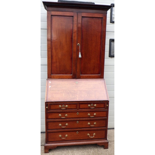 716 - A 19th cen oak & mahogany banded bureau with cupboard top, 102cm wide