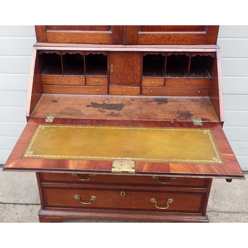 716 - A 19th cen oak & mahogany banded bureau with cupboard top, 102cm wide