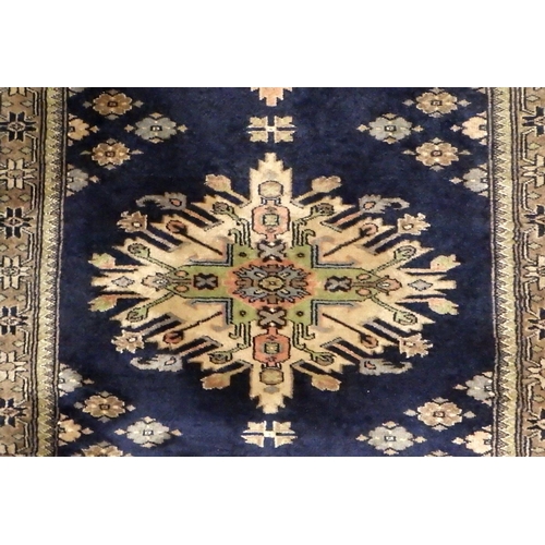 232 - A blue ground Turkish rug 95 x 160cm