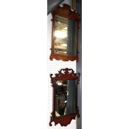 242 - Two mahogany fretwork mirrors