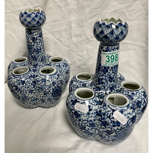 290 - A pair of Chinese blue and white tulip vases.  23cm tall