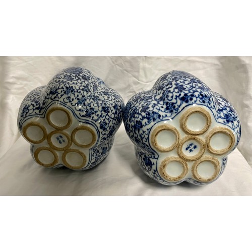 290 - A pair of Chinese blue and white tulip vases.  23cm tall