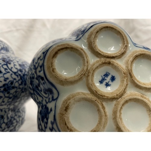 290 - A pair of Chinese blue and white tulip vases.  23cm tall