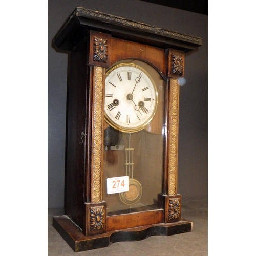 274 - A musical chiming 8 day clock 34cm tall