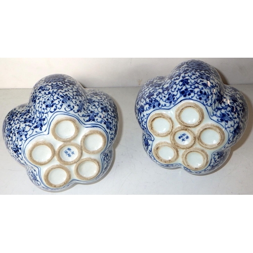 290 - A pair of Chinese blue and white tulip vases.  23cm tall