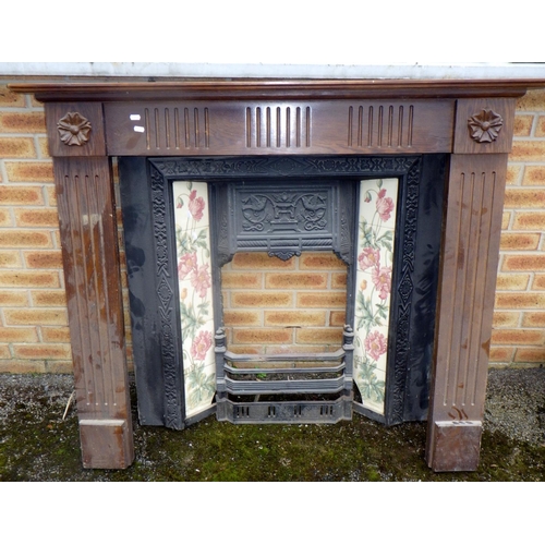 613 - A reproduction fire surround with inset