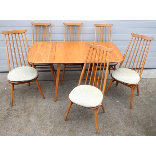 A blonde Ercol drop leaf dining table & six spindle back chairs (7)