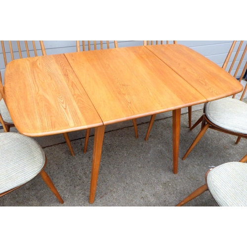 628 - A blonde Ercol drop leaf dining table & six spindle back chairs (7)