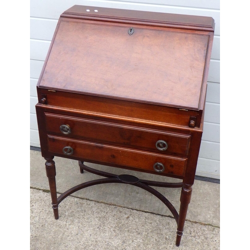 648 - A mahogany bureau on turned legs, 69cm wide