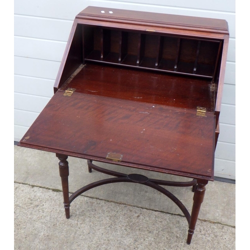 648 - A mahogany bureau on turned legs, 69cm wide