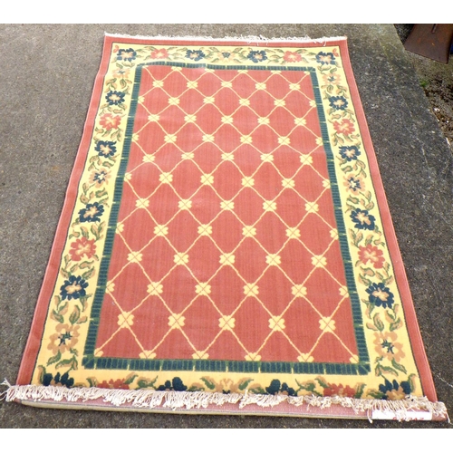 666 - A Lloyd loom ottoman, linen basket and a rug (3)