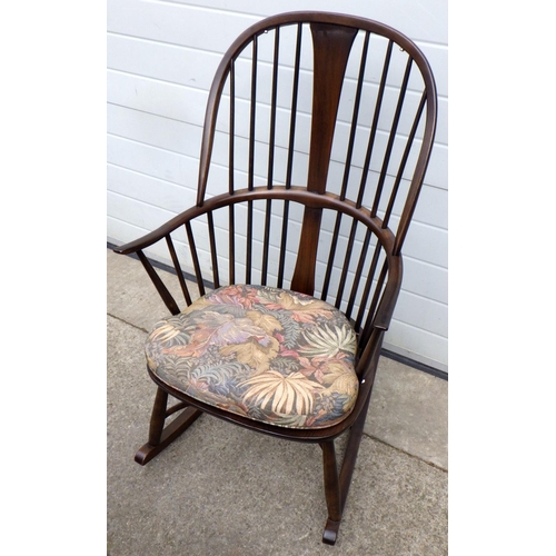 668 - A dark Ercol rocking chair