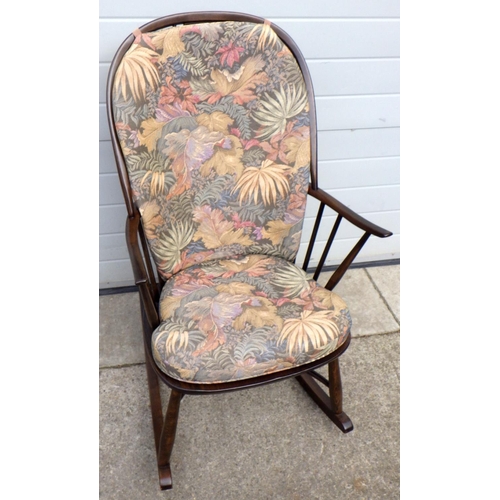 668 - A dark Ercol rocking chair