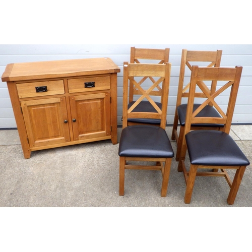 676 - A modern oak chiffonier together with four chairs