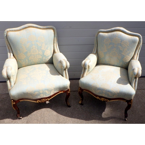 683 - A pair of Edwardian mahogany Empire style upholstered lady's & gents armchairs, some repair, missing... 