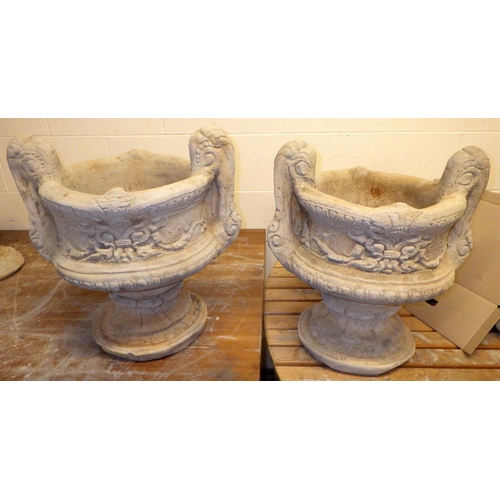 685 - A pair of concrete two handled garden urns, approx 51cm tall
