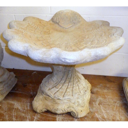 688 - A shell shaped concrete bird bath, approx 43cm tall