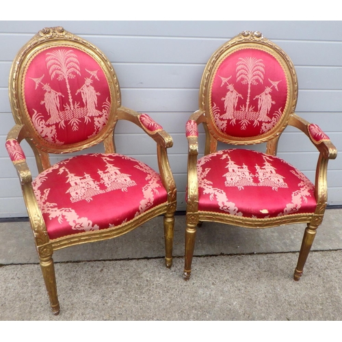 695 - A pair of gold painted Louis XVI style open armchairs
