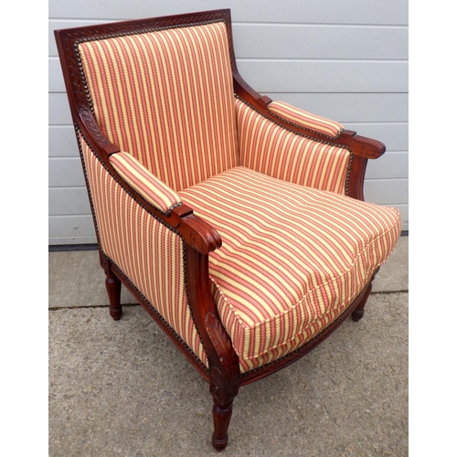 696 - A reproduction Edwardian style upholstered armchair