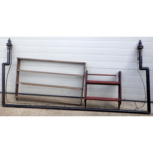 702 - A Victorian curtain rail, 261cm across together with two plate racks (3) (a/f)