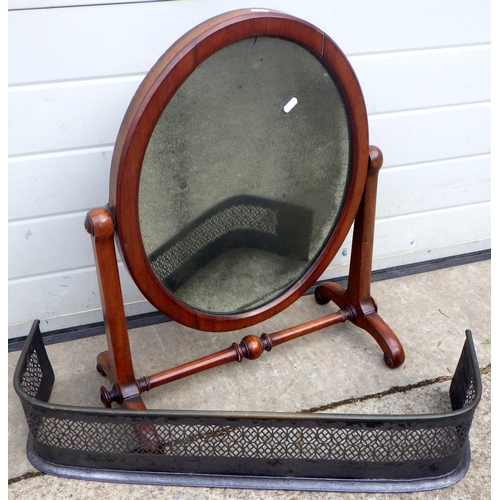 703 - A Victorian mahogany toilet mirror together with a small pierced fender (2)