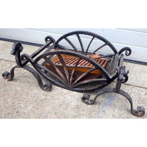 705 - A wrought iron fire grate